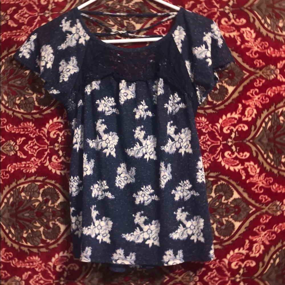 Super cute top with back cut out.